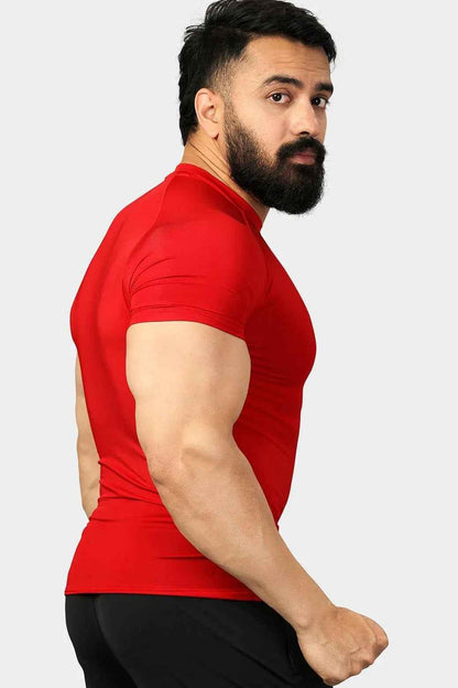 Red compression T-shirt by Fuaark Nz, designed for improved performance and comfort, shown on a model.
