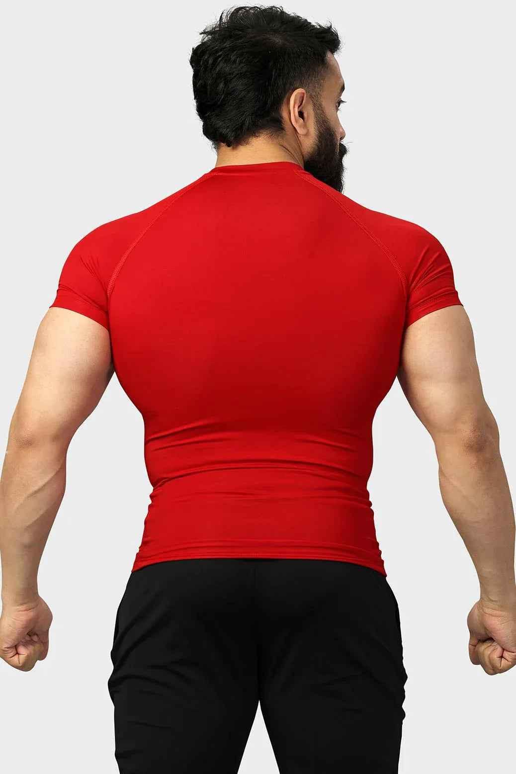 Red compression T-shirt by Fuaark NZ designed for enhanced performance and comfort, shown on a plain background.
