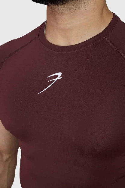 Fuaark Nz brown compression T-shirt for men, lightweight and fitted, showing the snug fit and material texture.
