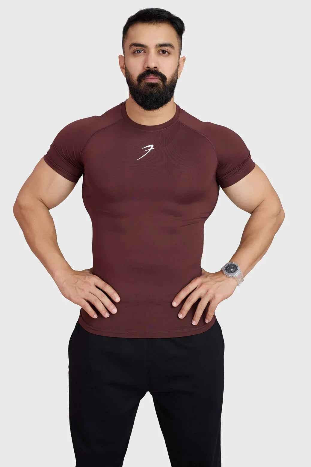 Brown compression T-shirt by Fuaark Nz, close-up of the snug-fitting athletic T-shirt with breathable fabric.