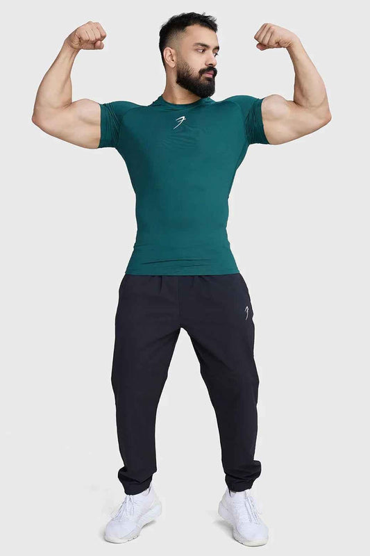 Emerald green compression T-shirt by Fuaark Nz, fitted athletic shirt with short sleeves and crew neckline.