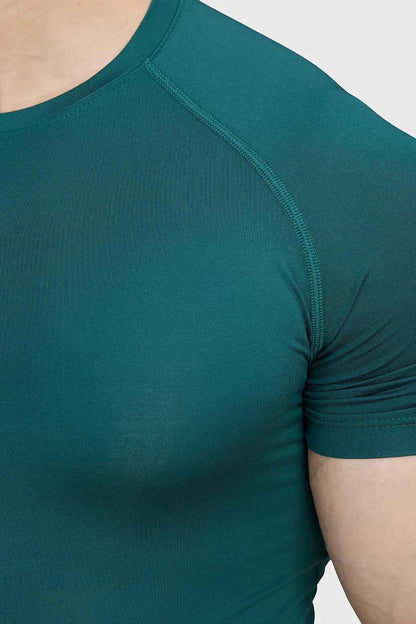 Emerald green compression T-shirt by Fuaark NZ, fitted athletic shirt with moisture-wicking fabric for active wear.