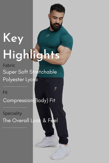 Emerald green compression T-shirt by Fuaark Nz featuring a snug fit and moisture-wicking fabric for athletic performance.