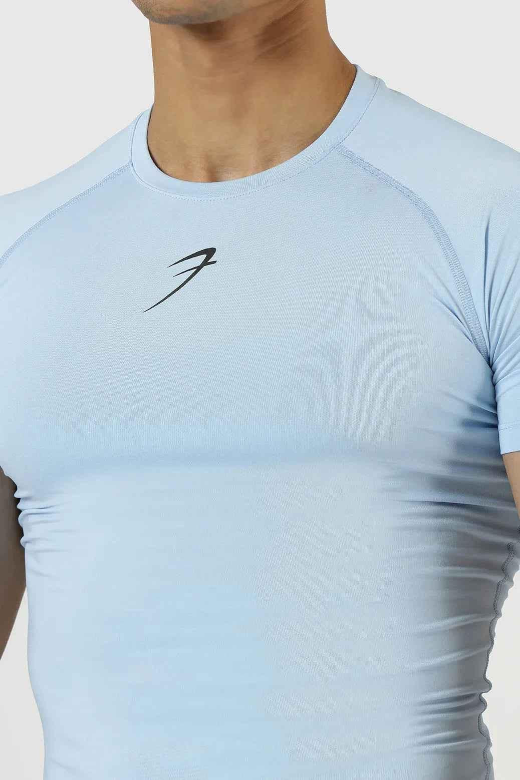 Men's compression T-shirt in Glacial Blue by Fuaark Nz, close-up of fitted athletic shirt with short sleeves and sleek fabric.