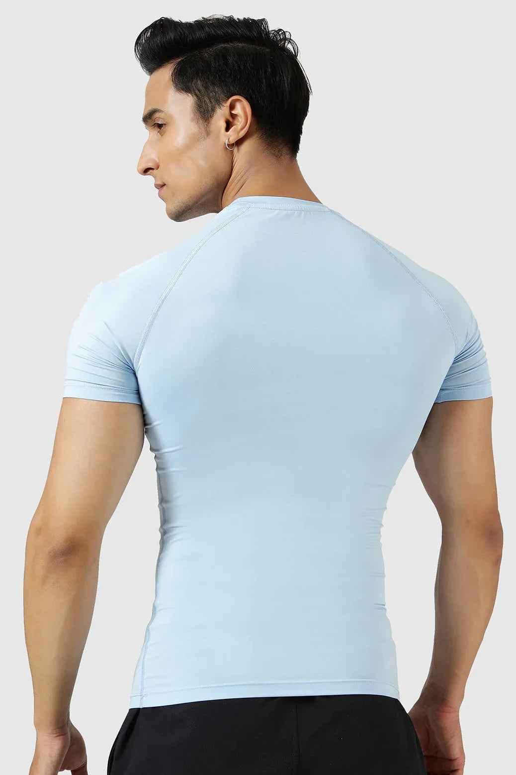 Men's compression T-shirt in Glacial Blue by Fuaark Nz, featuring a fitted design and breathable fabric for active wear.