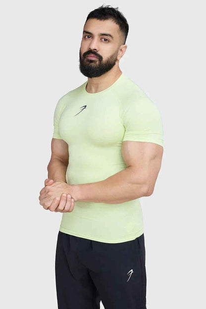 Fuaark Nz lime compression T-shirt for men, close-up of fitted athletic shirt with logo and breathable fabric.