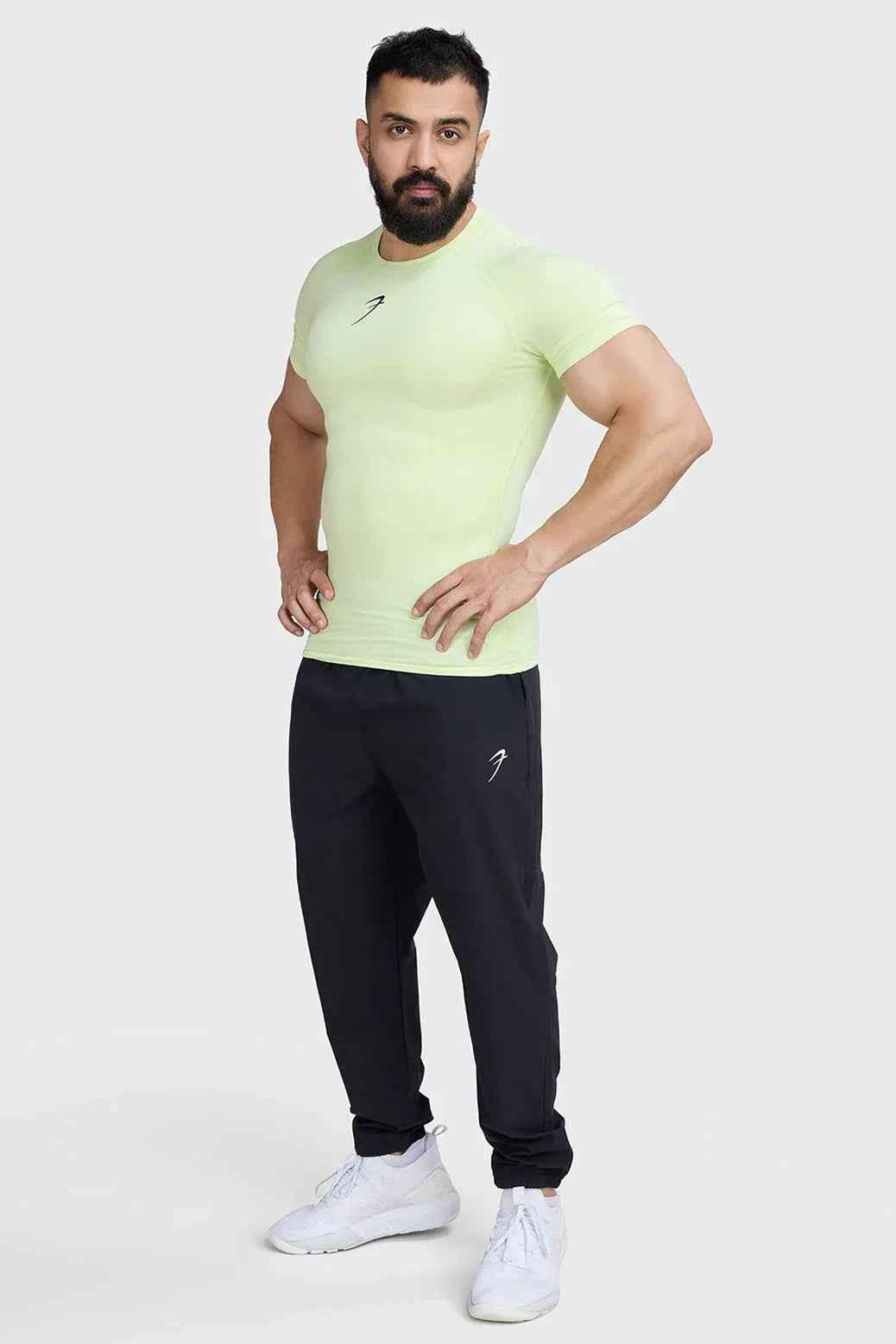Fuaark Nz lime compression T-shirt for men, featuring a snug fit and breathable fabric, ideal for active wear.