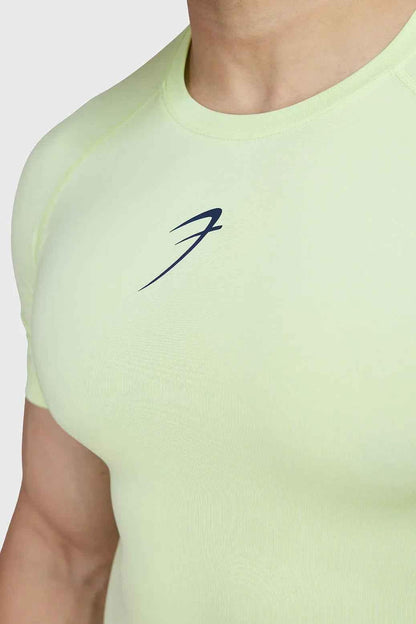 Bright lime compression T-shirt from Fuaark Nz, showcasing a fitted athletic style with short sleeves and smooth fabric.
