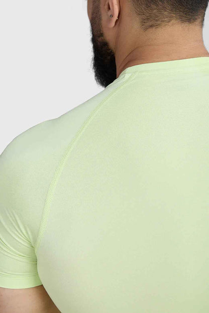 Fuaark Nz lime compression T-shirt for men, snug fit, lightweight fabric, casual athletic style, shown on a mannequin.