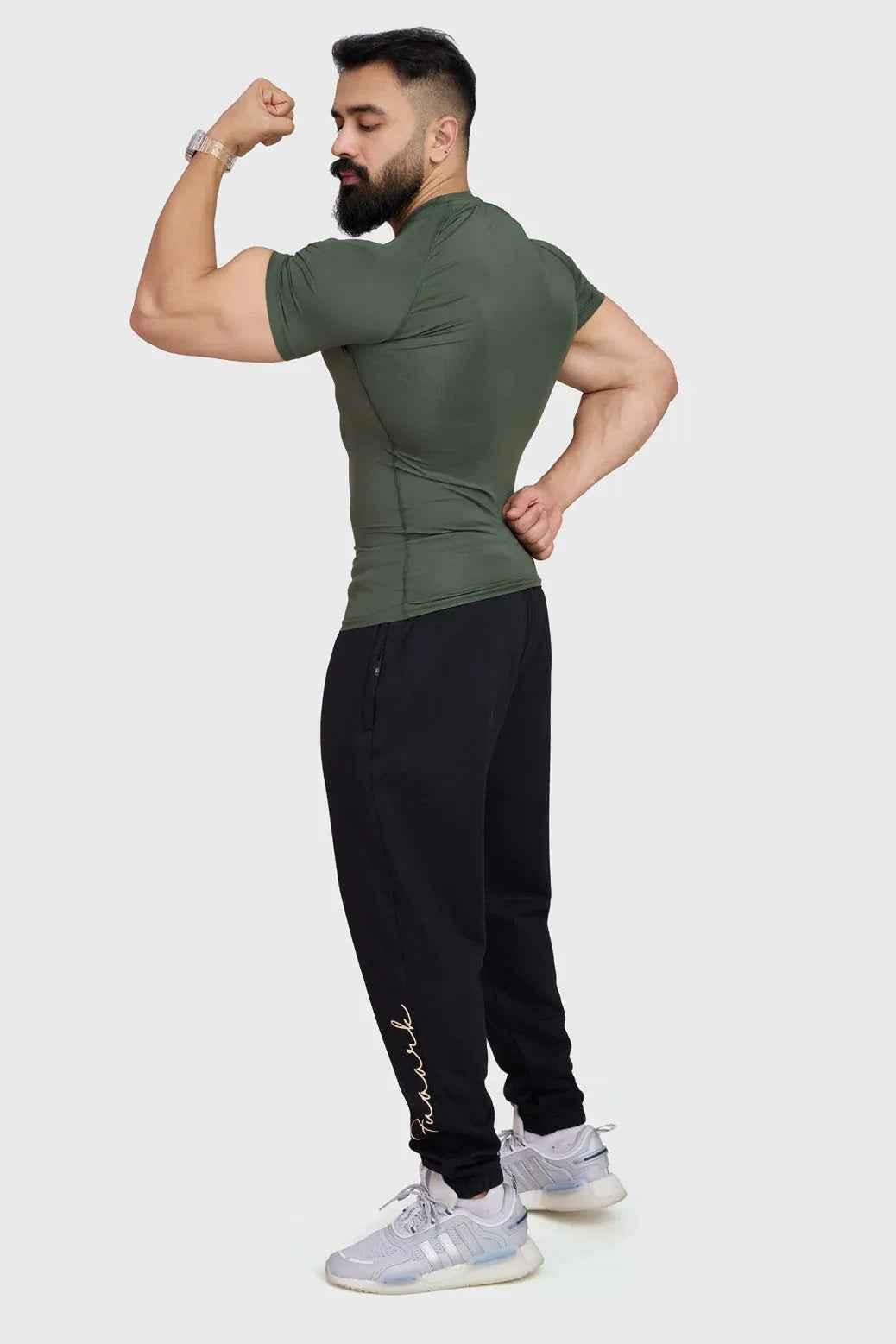 Olive green Fuaark Nz compression T-shirt for men, snug fit with breathable fabric, designed for active wear.