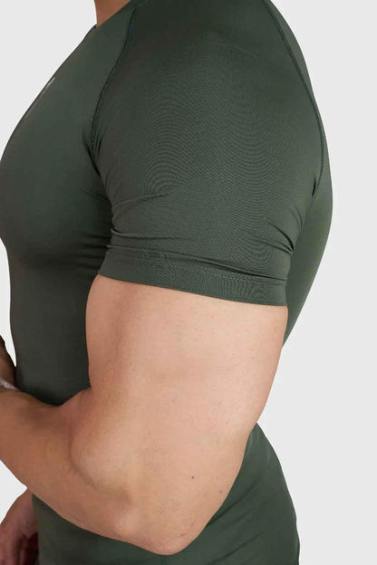 Olive green Fuaark Nz compression T-shirt for men, fitted and stretchy athletic shirt with short sleeves.