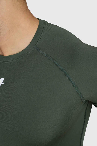 Olive green Fuaark Nz compression t-shirt for men, close-up view showing fitted athletic design and soft fabric texture.