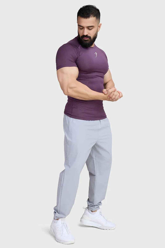 Fuaark Nz compression T-shirt in plum color, fitted athletic T-shirt with moisture-wicking fabric for active wear.