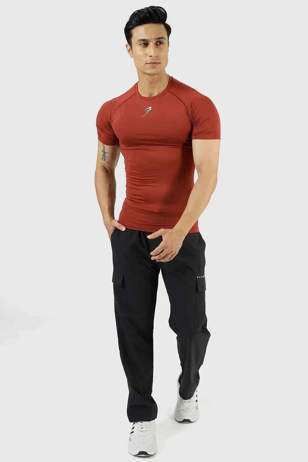 Fuaark Nz compression T-shirt Salsa in black, designed for athletic performance and muscle support, shown on a model.