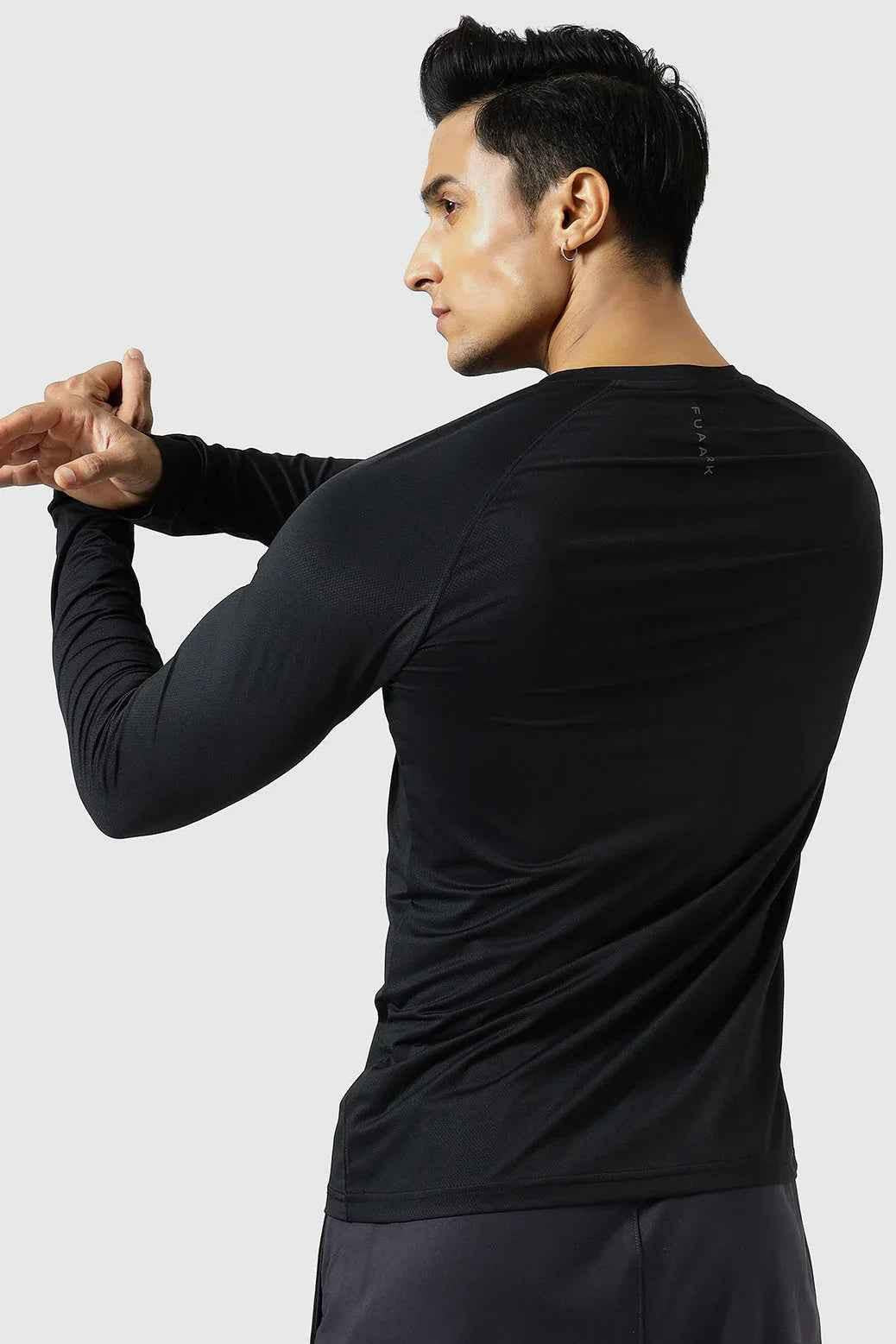 Black Core Fullsleeves T-shirt by Fuaark Nz, featuring a fitted design and long sleeves, shown on a plain background.