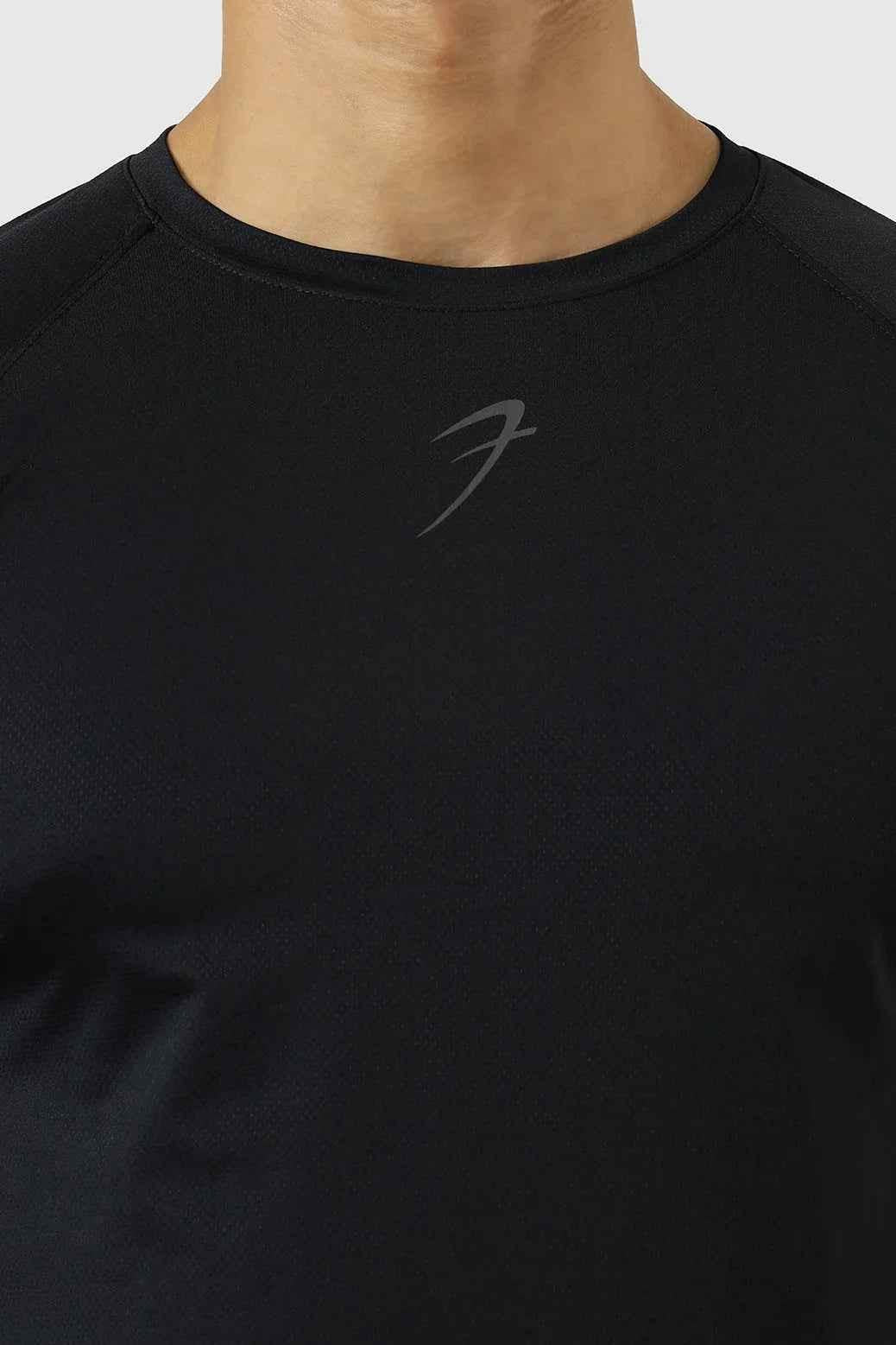 Black Fuaark Nz Core Fullsleeves T-shirt displayed on a hanger, showcasing its long-sleeve design and casual fit.