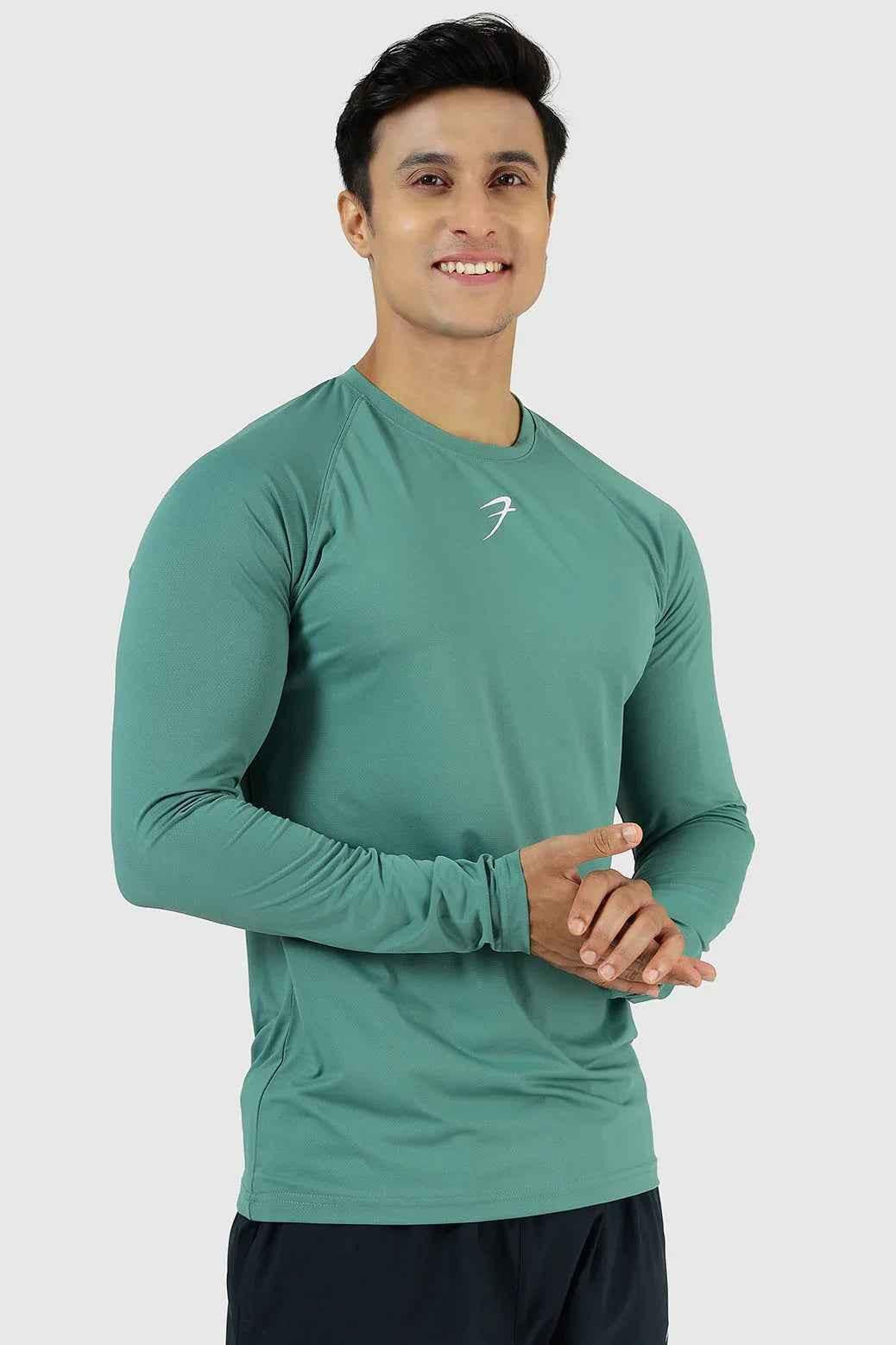 Fuaark Nz Core Fullsleeves T-shirt in pine color, made from soft fabric, featuring a comfortable fit and long sleeves.