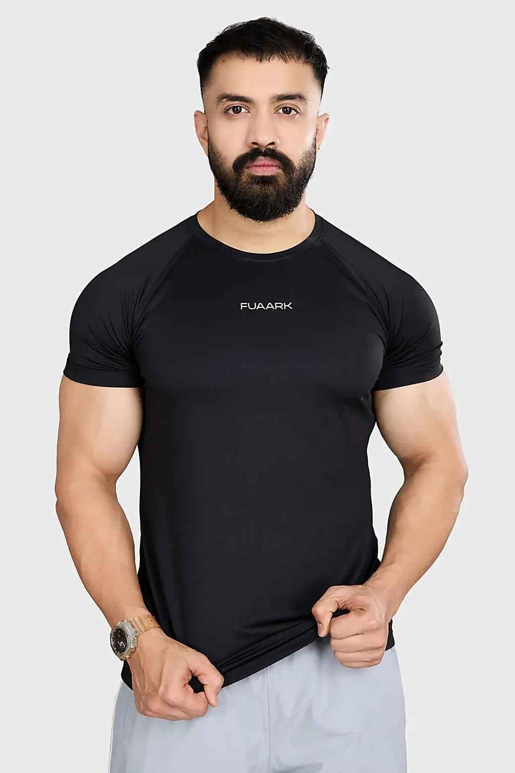 Fuaark NZ black T-shirt displayed flat, showcasing its stylish and comfortable design as a versatile essential clothing item.