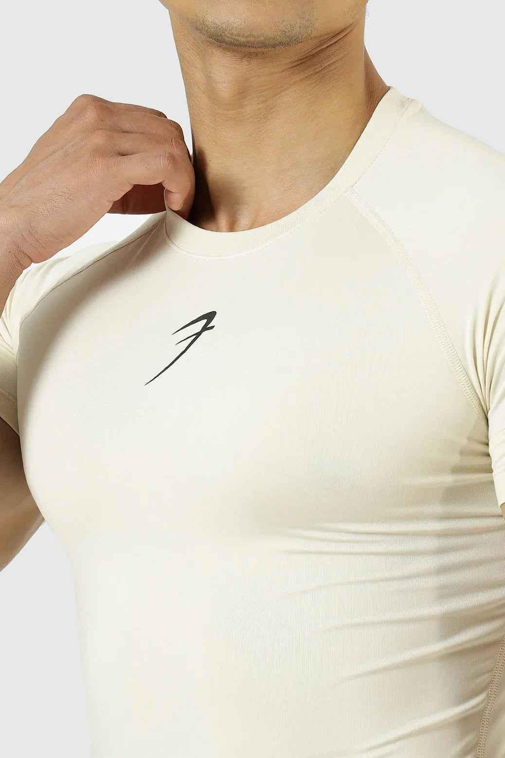 Beige Fuaark Nz compression T-shirt for men, fitted athletic shirt designed to elevate your game and enhance performance.