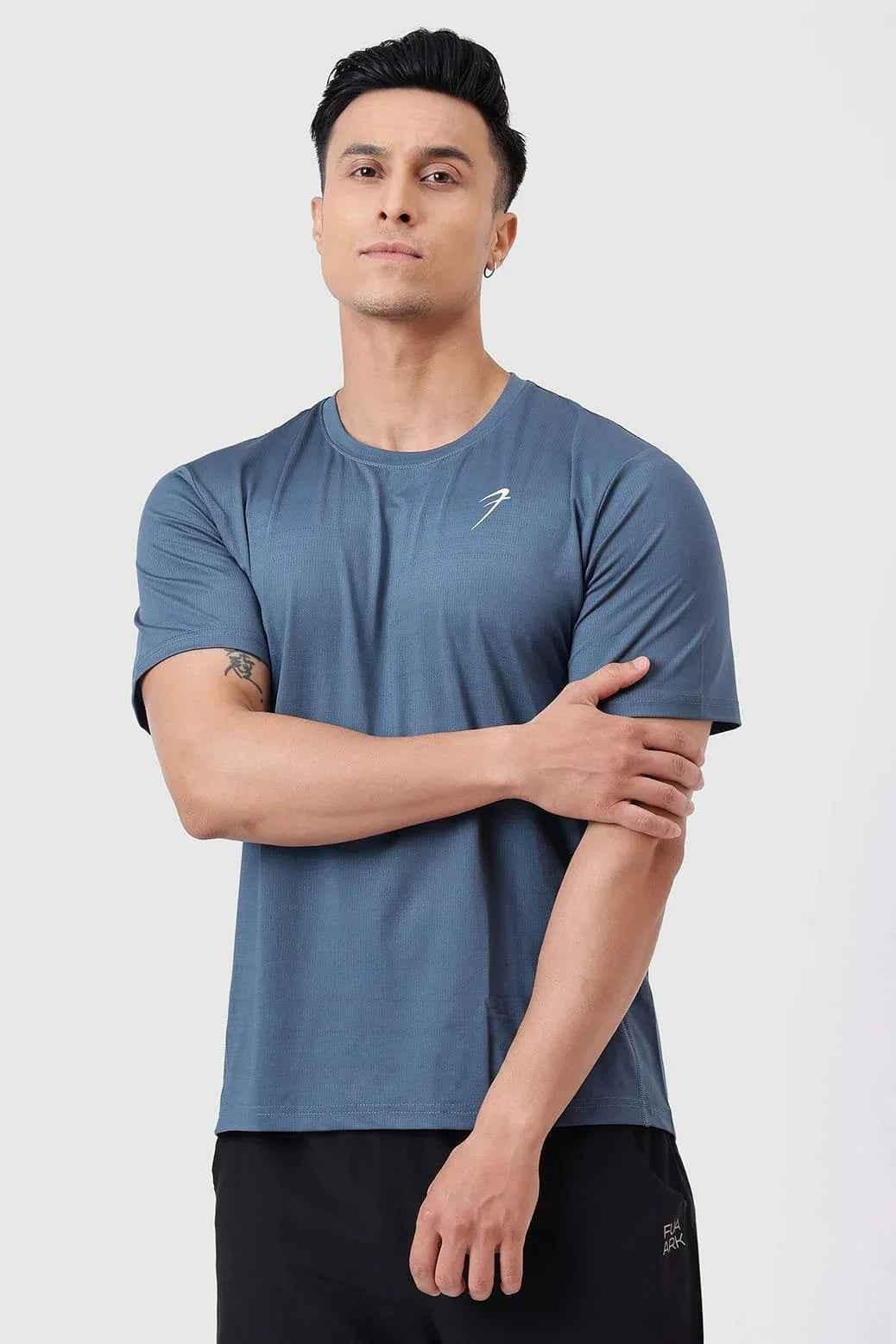 Fuaark Nz Ember Light Blue running T-shirt for ultimate performance, made of breathable fabric, close-up view of athletic T-shirt.