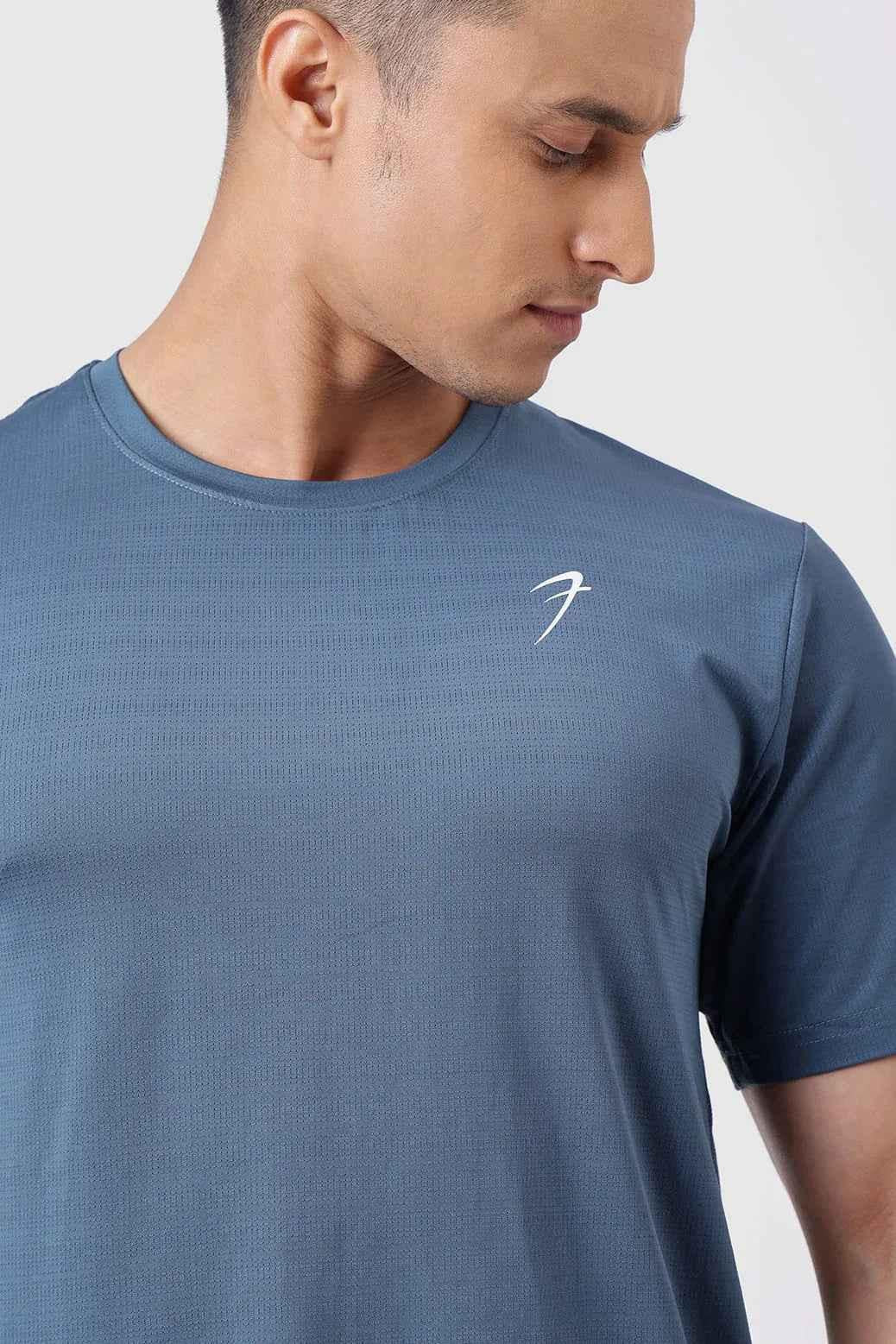 Fuaark NZ Ember Light Blue running T-shirt for ultimate performance, showing a fitted athletic T-shirt with moisture-wicking fabric.