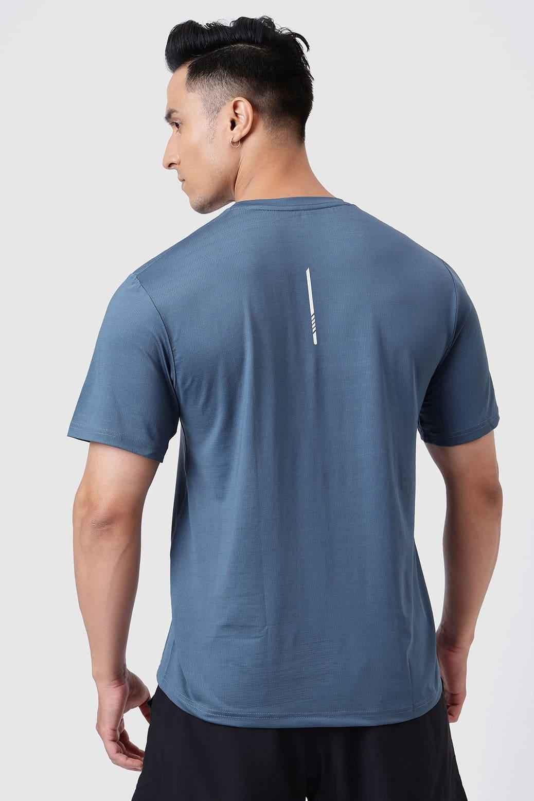 Fuaark Nz Ember Light Blue running T-shirt for ultimate performance, made from breathable athletic fabric, close-up view.