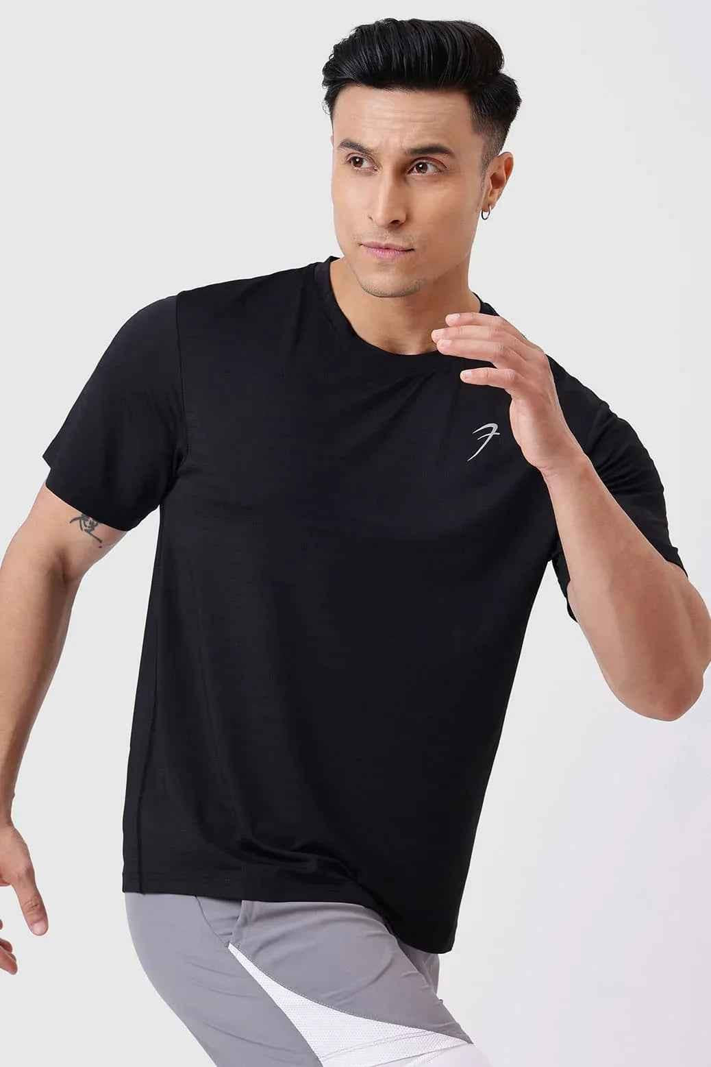 Fuaark Nz Ember Running T-shirt in black, showcasing a comfortable fit and athletic design for active wear.