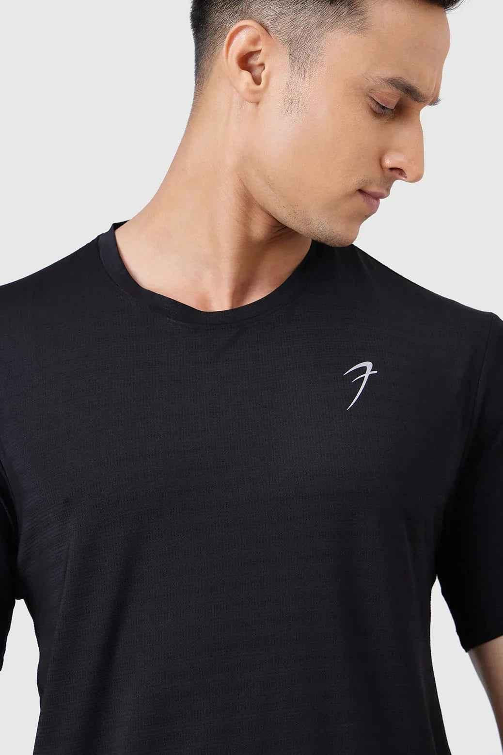 Black Ember Running T-shirt by Fuaark Nz, showcasing a comfortable fit and sporty design for active wear.