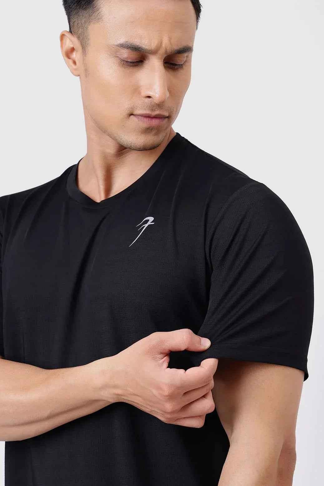 Black Ember Running T-shirt by Fuaark Nz, lightweight and athletic fit, shown on a mannequin with short sleeves and breathable fabric.