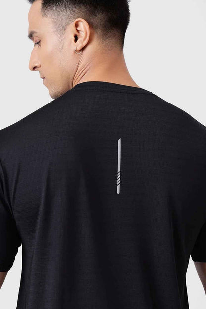 Black Ember Running T-shirt by Fuaark Nz, showing a close-up of the lightweight, breathable fabric and athletic fit.