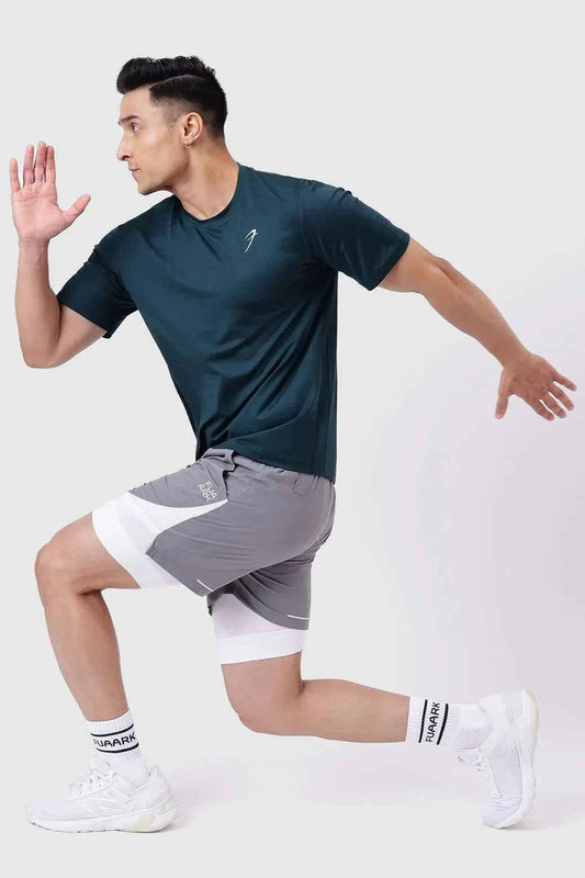 Fuaark Nz Ember Running T-shirt in bottle green, lightweight athletic T-shirt with breathable fabric for running and active wear.