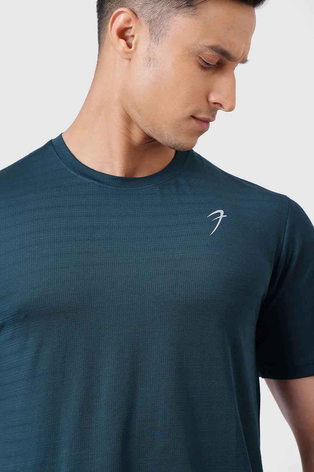 Fuaark Nz Ember Running T-shirt in bottle green, lightweight athletic tee with moisture-wicking fabric, suitable for running and workouts.