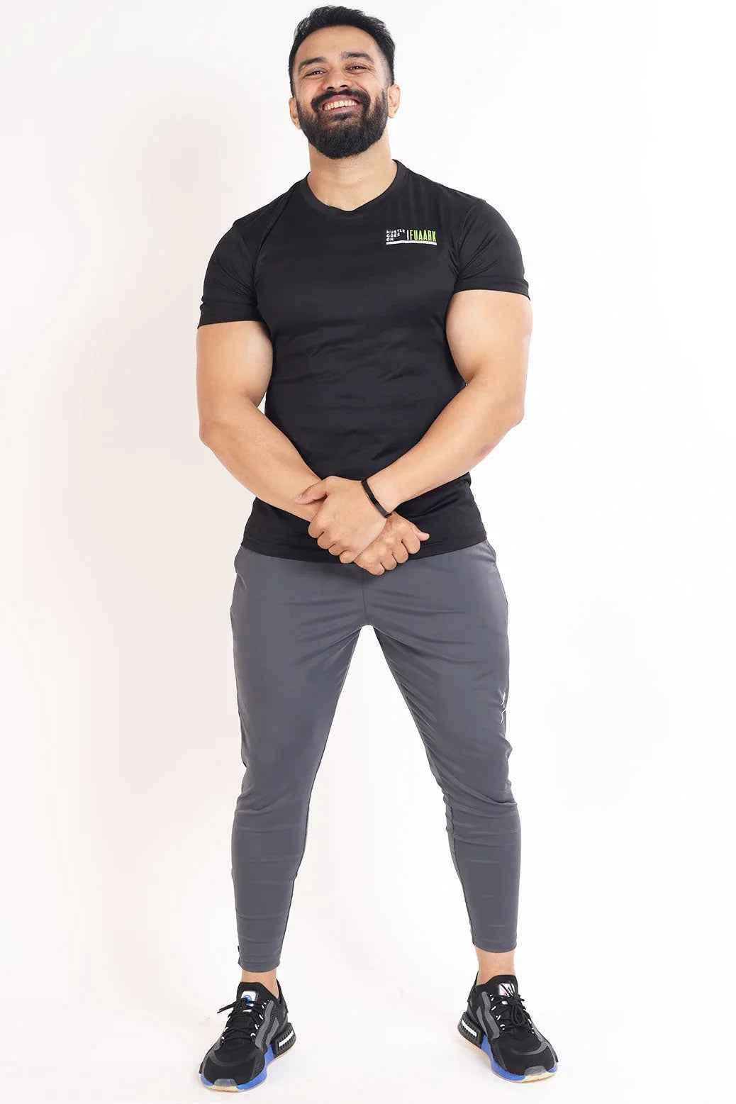 Black T-shirt with Fuaark Nz emblem, casual unisex tee made of soft fabric, featuring a minimalist logo design.