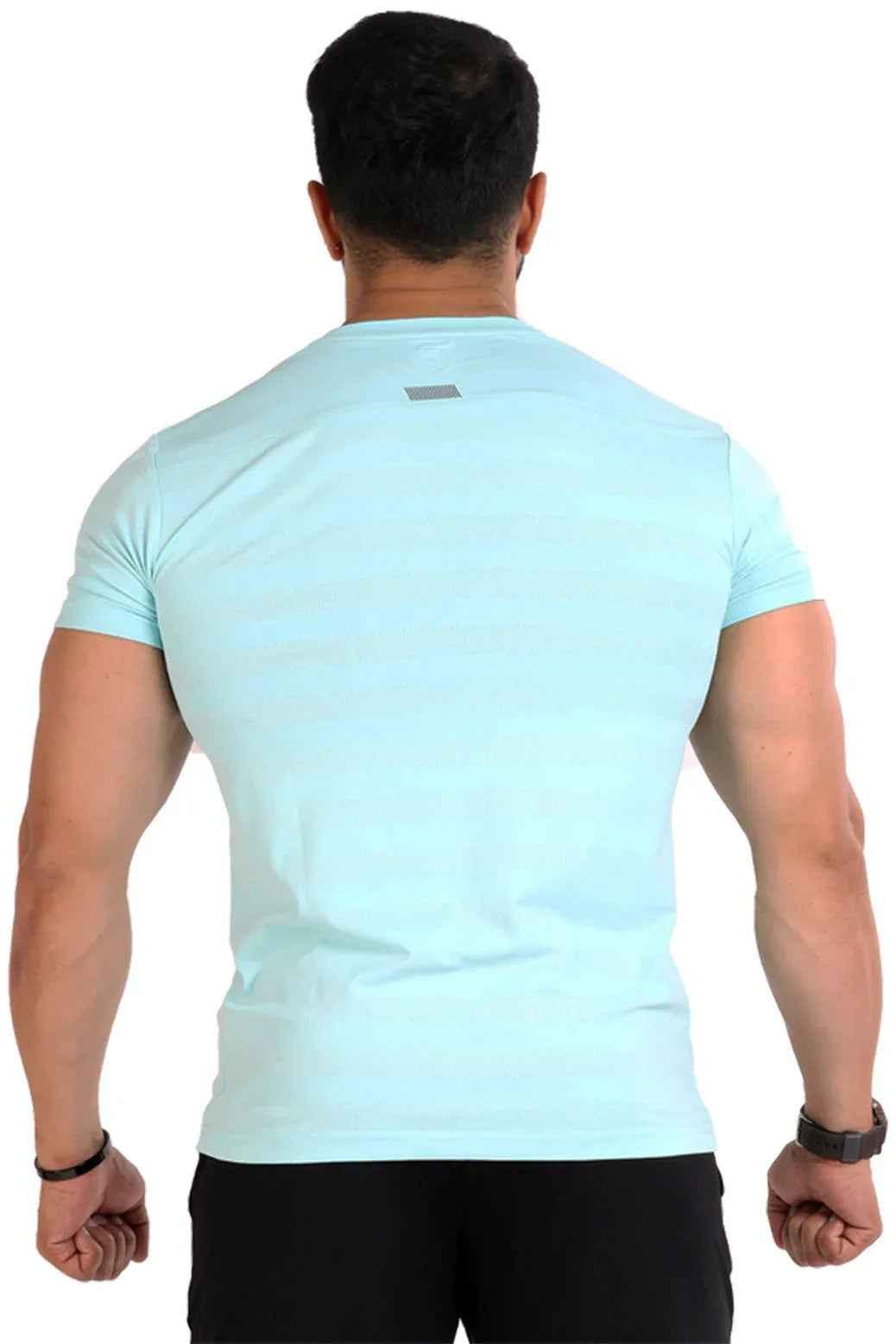 Sky blue Emblem T-shirt by Fuaark Nz, casual short-sleeve shirt with a front emblem design, made from soft fabric.