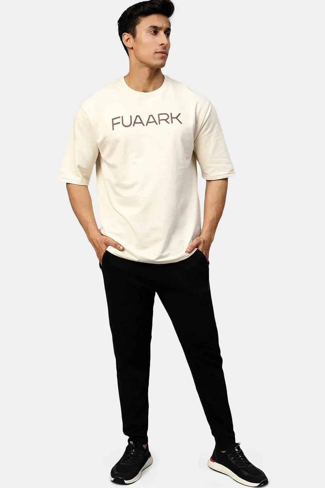 Beige oversized Energy T-shirt by Fuaark Nz, casual fit, featuring a relaxed design and short sleeves.