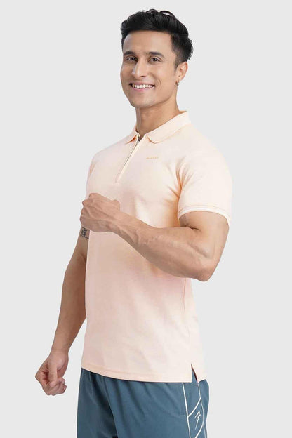 Fuaark Nz Heritage Polo T-shirt in peach color, casual fit, soft cotton fabric, displayed on a plain background.