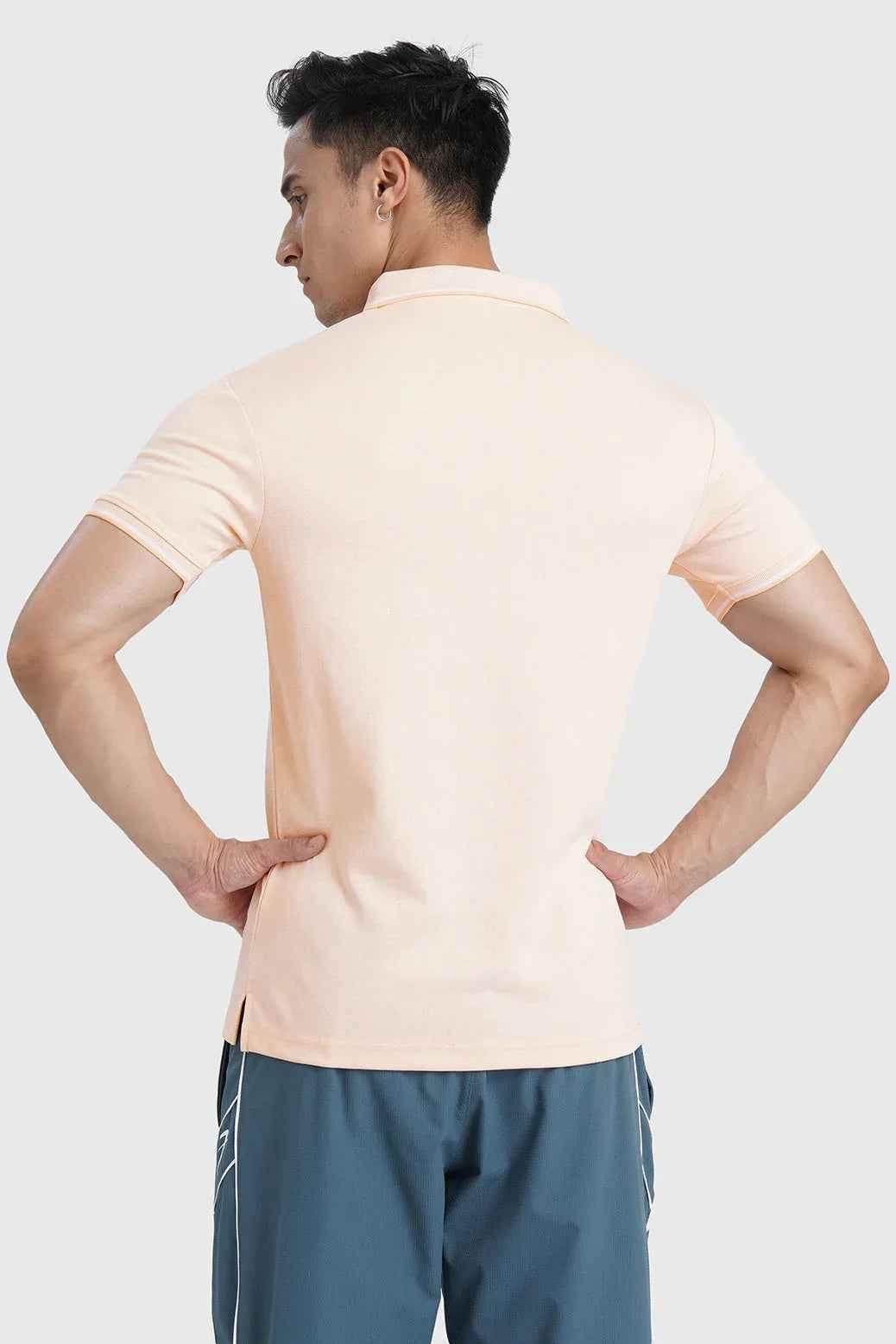 Fuaark Nz Heritage Polo T-shirt in peach, showcasing a casual cotton tee with a classic polo collar and short sleeves.