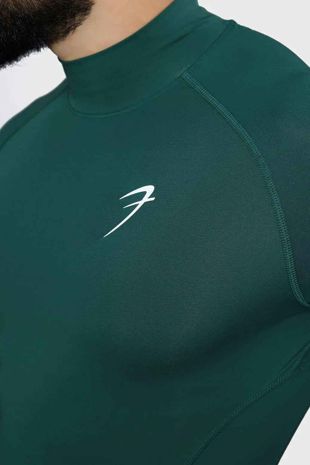 Emerald high neck compression full sleeve T-shirt by Fuaark Nz, showcasing a sleek fit and comfortable design.