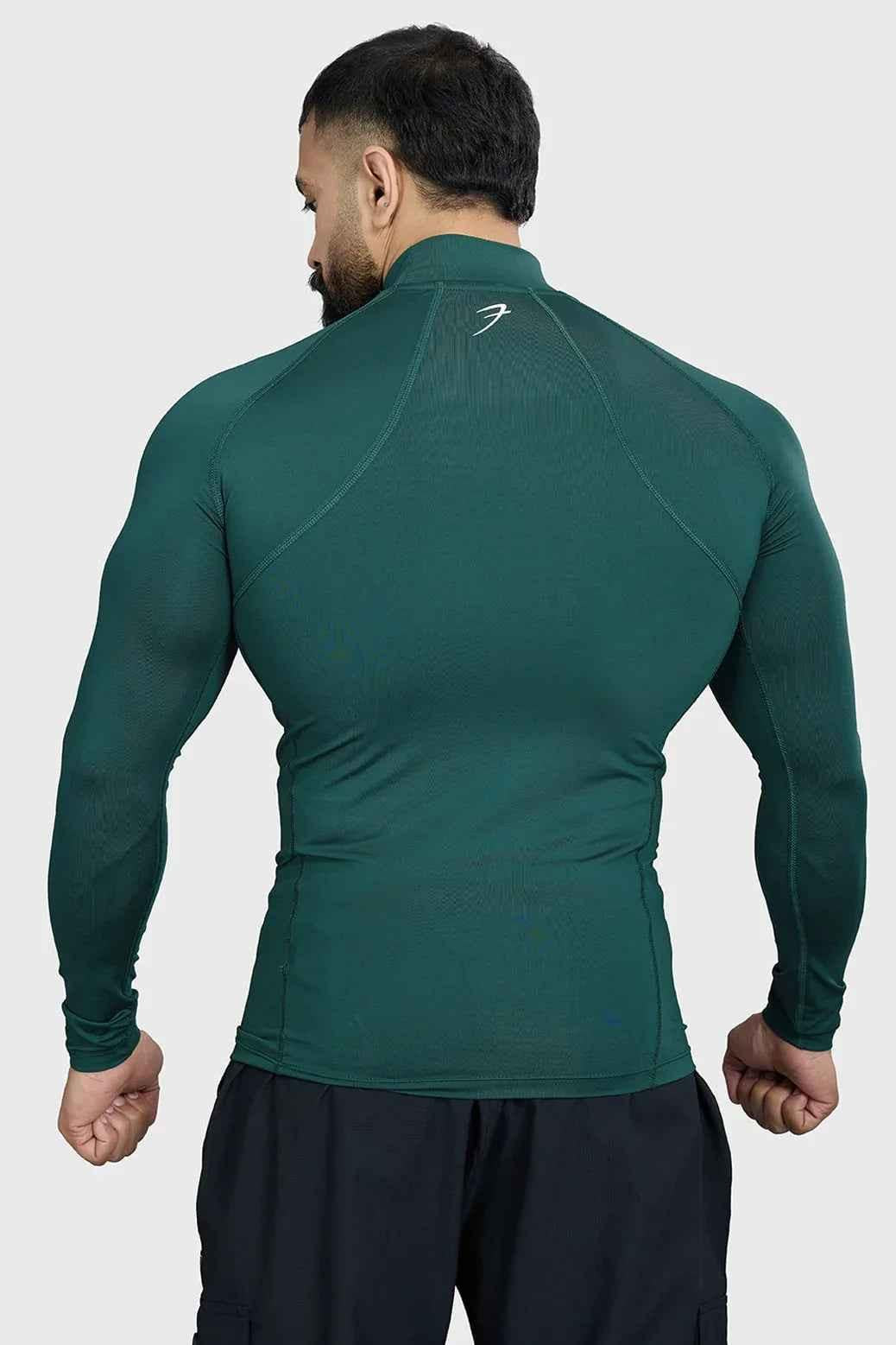 Emerald high neck compression full sleeves T-shirt by Fuaark Nz, made of stretchy, supportive fabric for active wear.