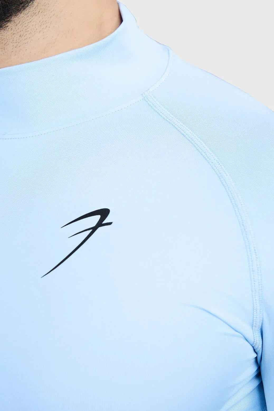 Glacial blue high neck compression full sleeves T-shirt by Fuaark NZ, made of sleek, stretchy fabric for comfort and support.