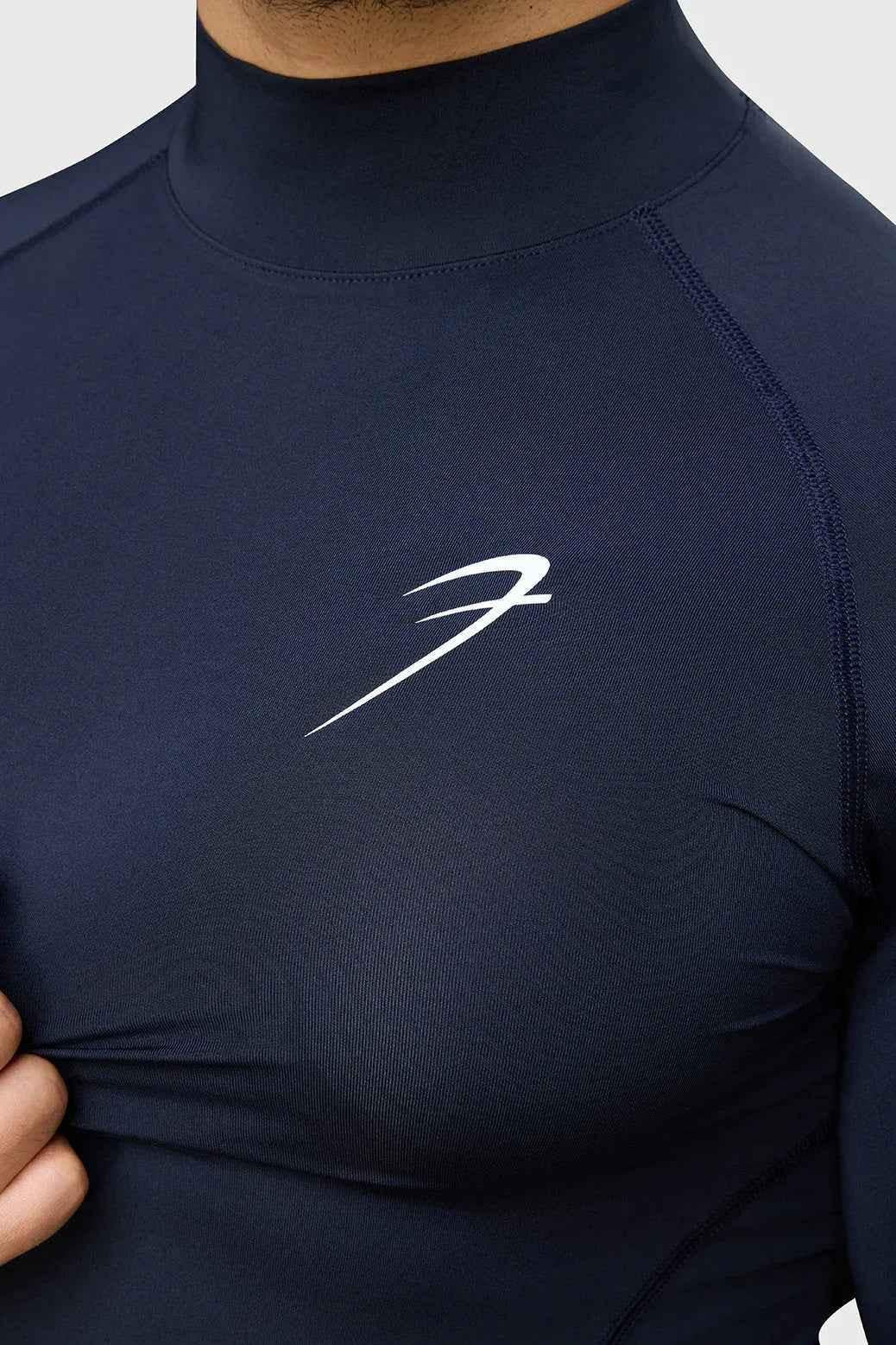 Navy high neck compression full sleeves T-shirt by Fuaark Nz, made of stretchy, supportive fabric for active wear.