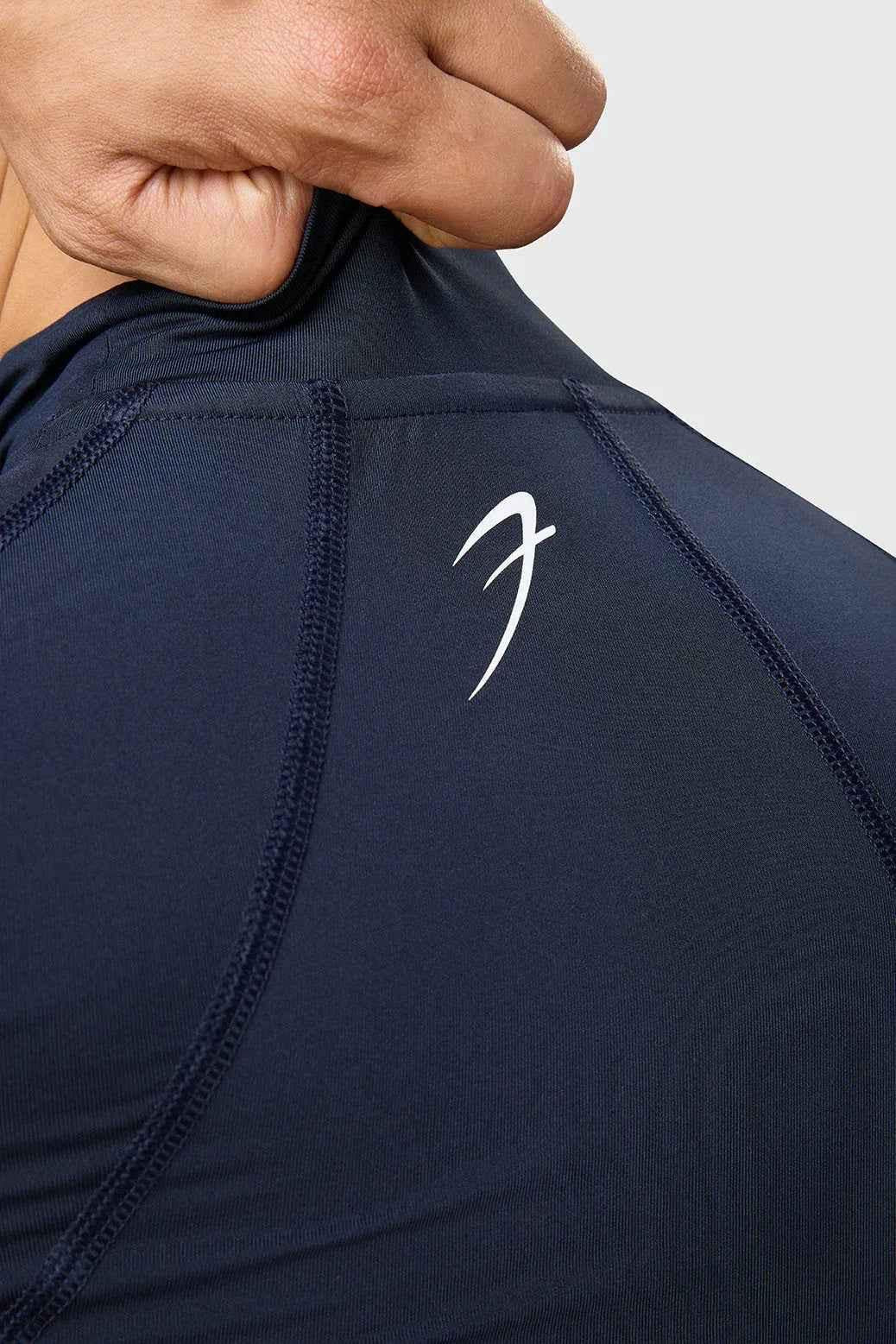 Navy high neck compression T-shirt with full sleeves from Fuaark Nz, designed for a snug fit and athletic support.