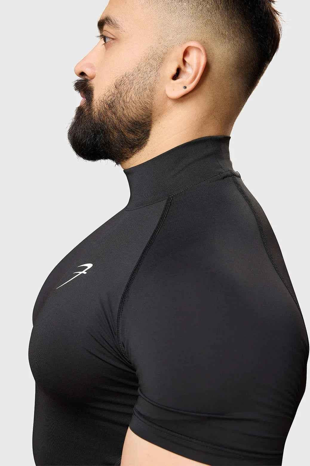Black high neck compression T-shirt by Fuaark NZ, shown with snug fit and smooth fabric, ideal for athletic or casual wear.