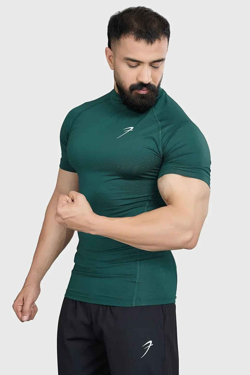Fuaark Nz high neck compression T-shirt in emerald color, showcasing a close-up of the fitted, stretchy fabric for athletic performance.