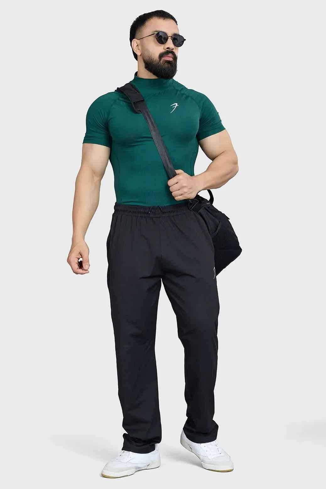Fuaark Nz high neck emerald compression T-shirt for men, close-up view showing fitted fabric and high neckline.