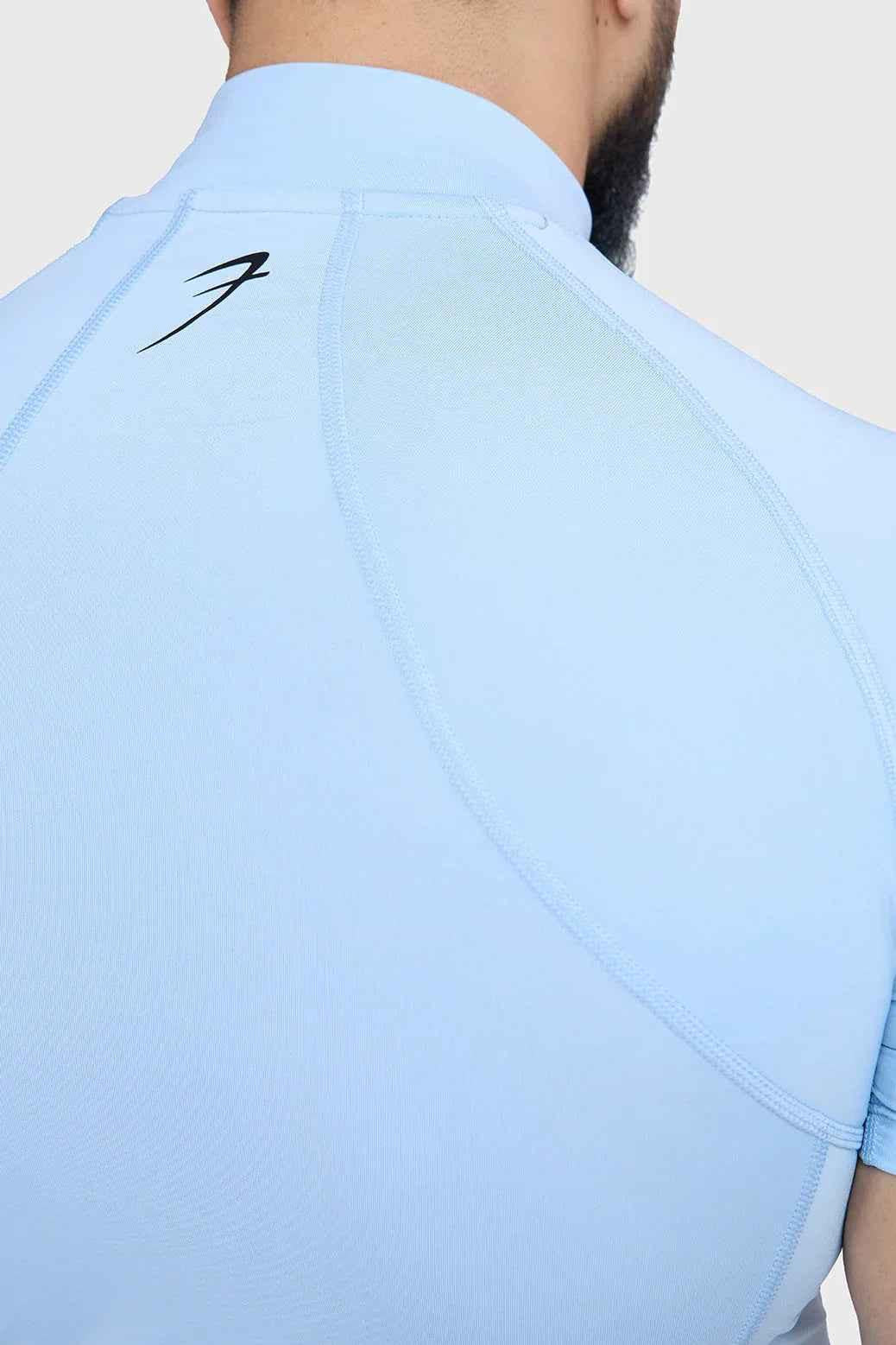 Fuaark Nz high neck compression T-shirt in Glacial Blue, close-up showing sleek fit and stretchy fabric design.