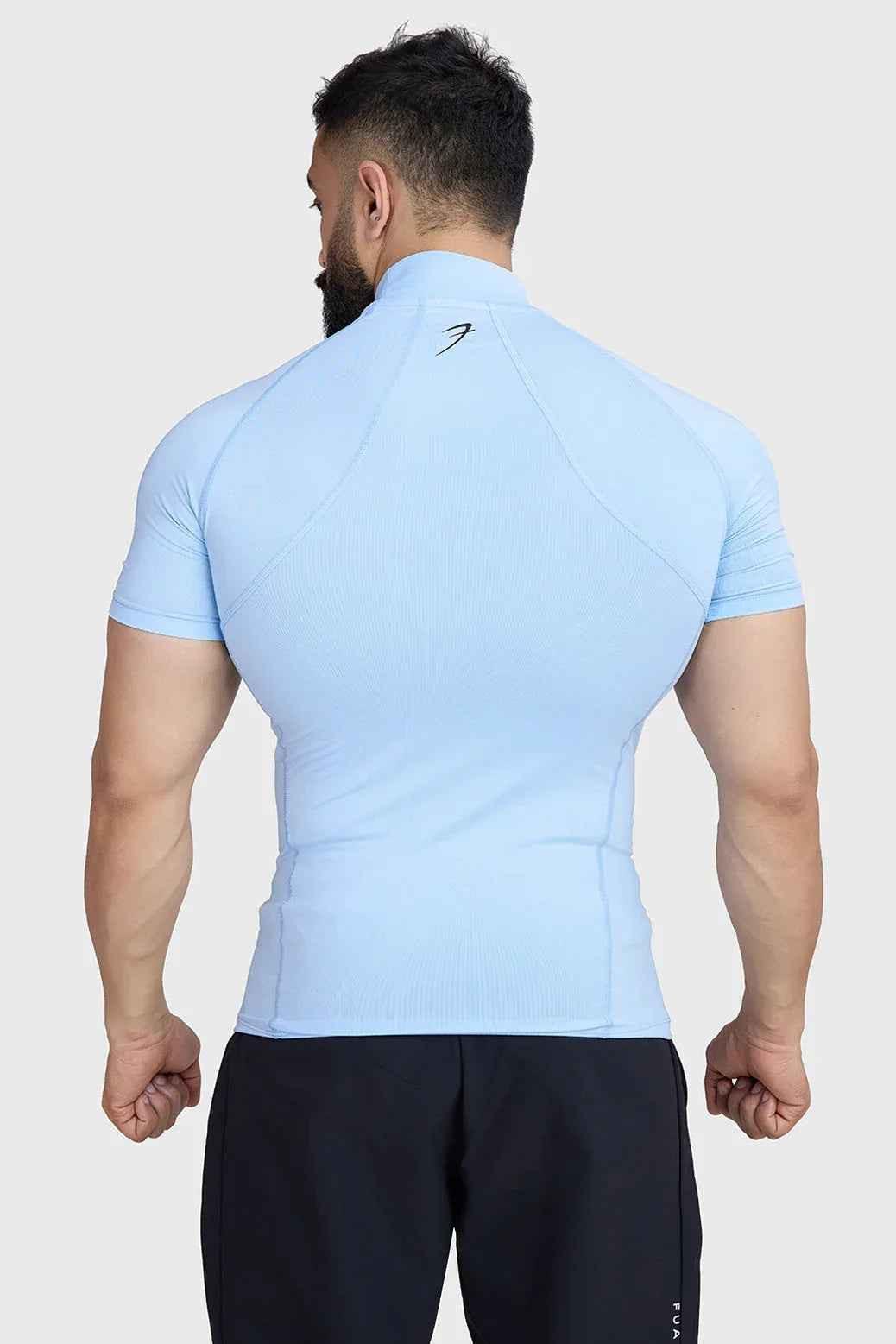 Fuaark Nz high neck compression T-shirt in glacial blue, close-up of soft, stretchy fabric and sleek fit design.