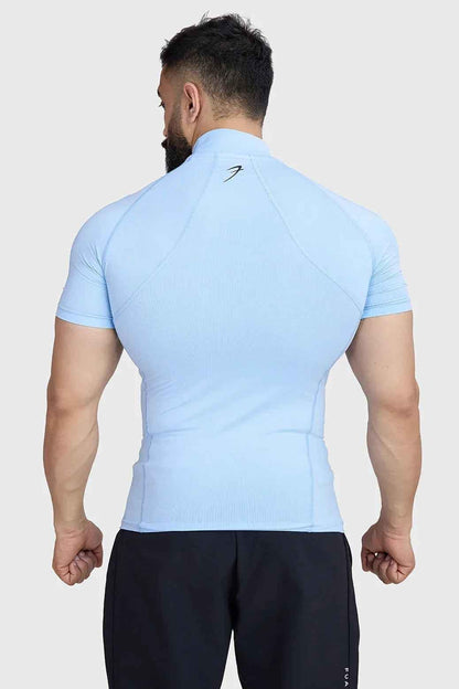 Fuaark Nz high neck compression T-shirt in glacial blue, close-up of soft, stretchy fabric and sleek fit design.