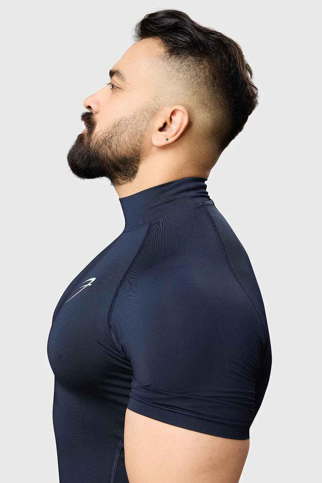 Navy high neck compression T-shirt by Fuaark Nz, close-up view showing fitted design and smooth fabric.