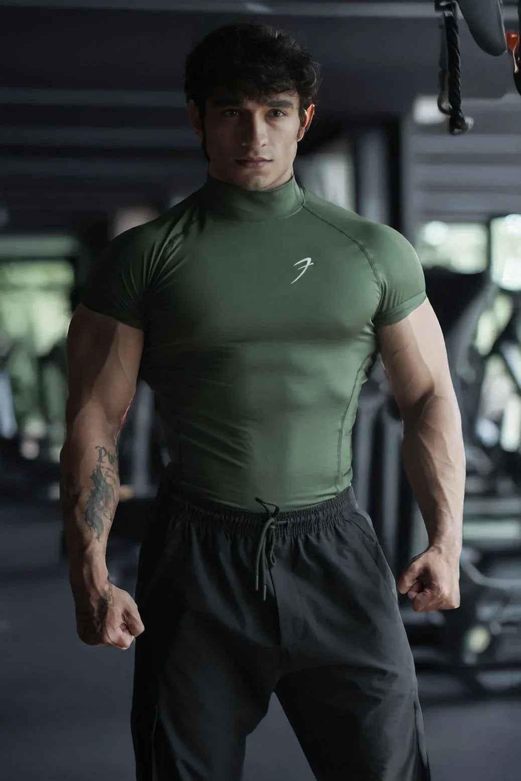 Olive high neck compression T-shirt by Fuaark Nz, made from stretchy, supportive fabric, shown on a plain background.